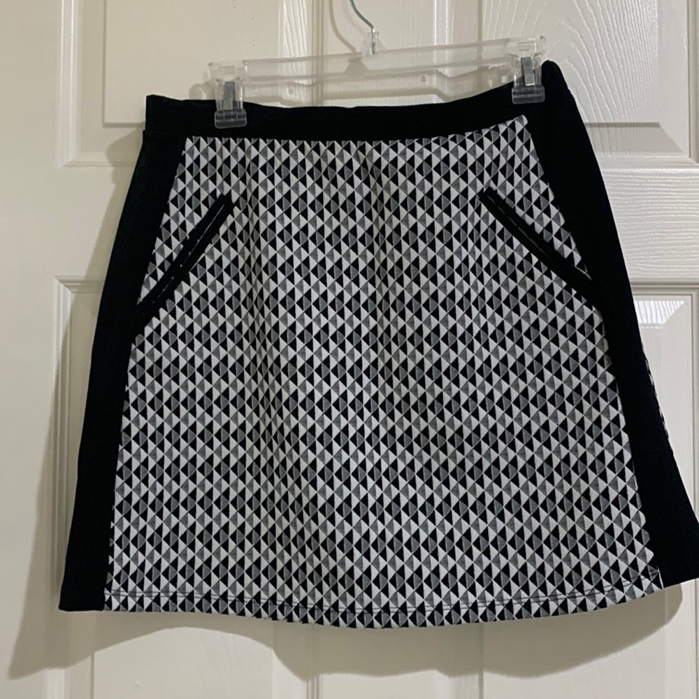 A perfect black and white print skirt.  Not really a mini. Brand new